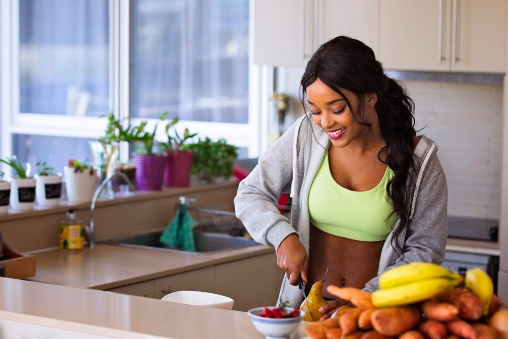 Person chopping fresh fruit