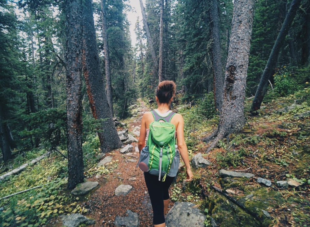 a women hiking on a trail